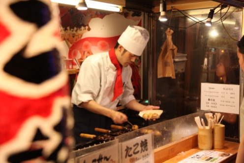 cooking takoyaki.